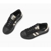 Oblíbená dámská sportovní obuv černé barvy se zlatým motivem